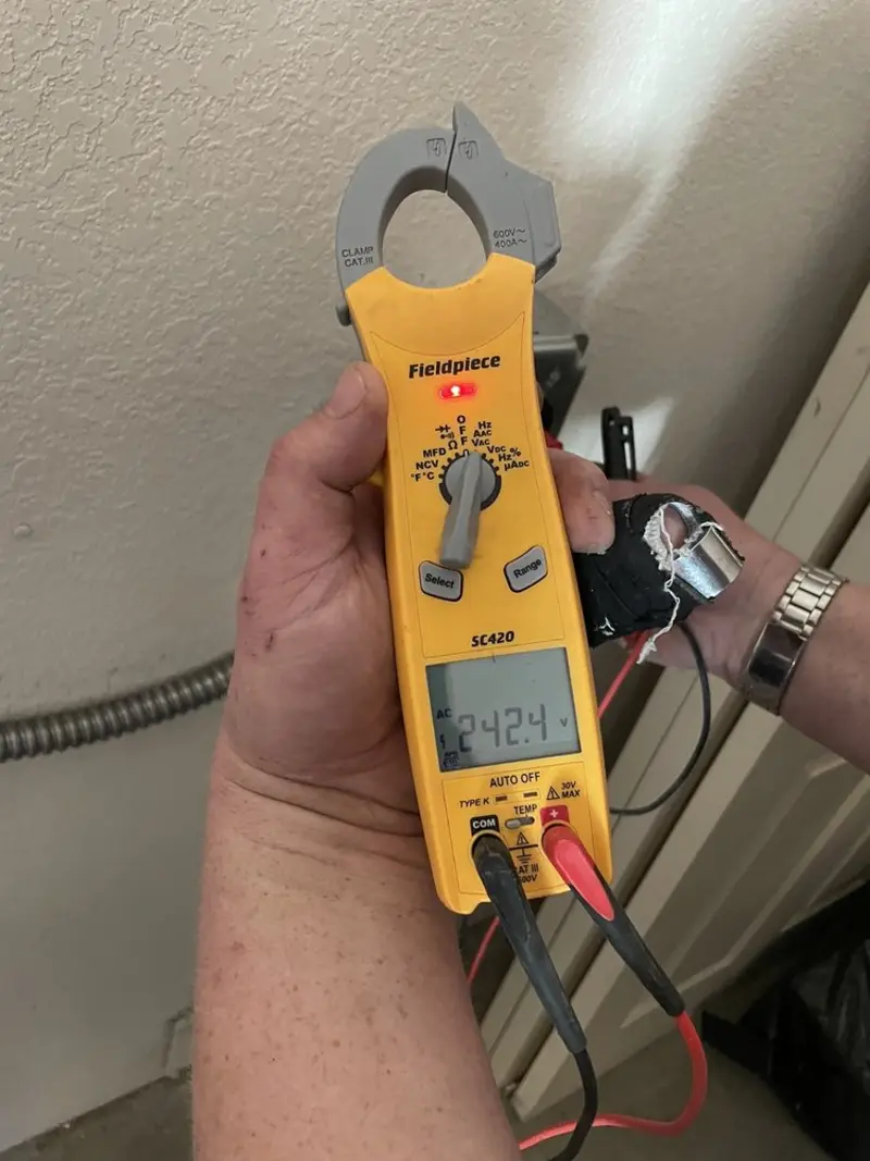 Voltage testing with clamp meter during Circuit Breaker Repair in Grosse Pointe Farms